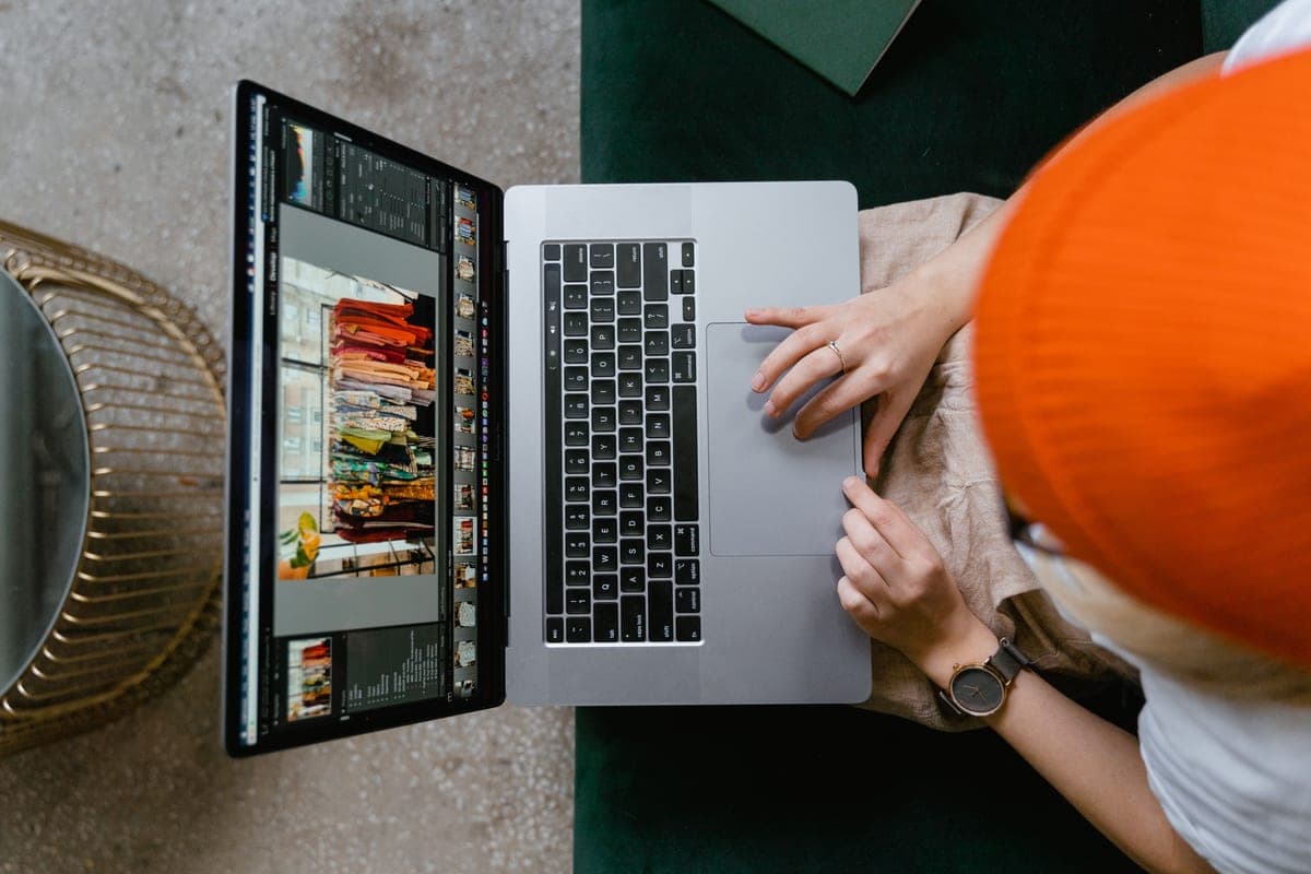 A person working on design software at a laptop